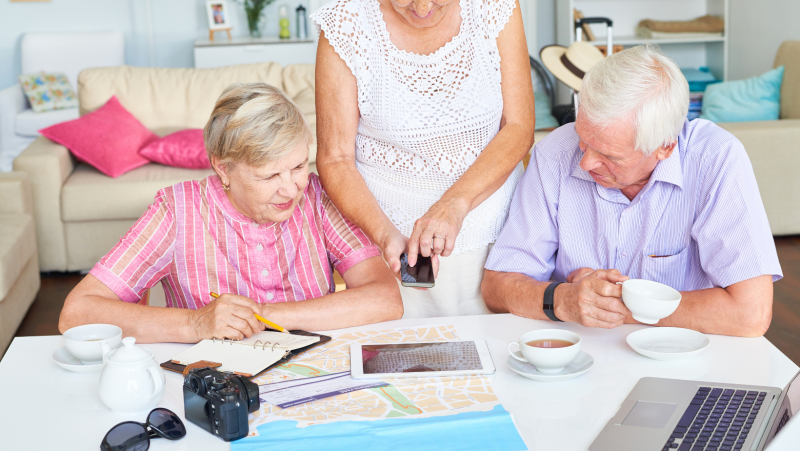 Elderly people discussing digital plans